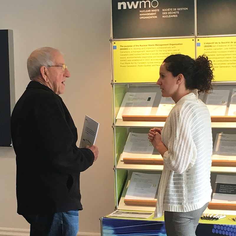 This picture shows a Central Huron man discussing Canada’s plan for the safe, long-term management of used nuclear fuel with an NWMO staff member at an open house in Clinton.
