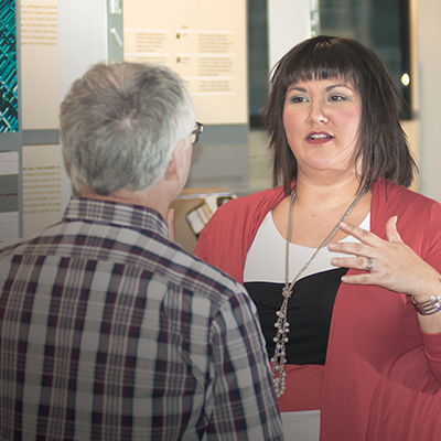 This image shows a NWMO employee engaging at a community open house.