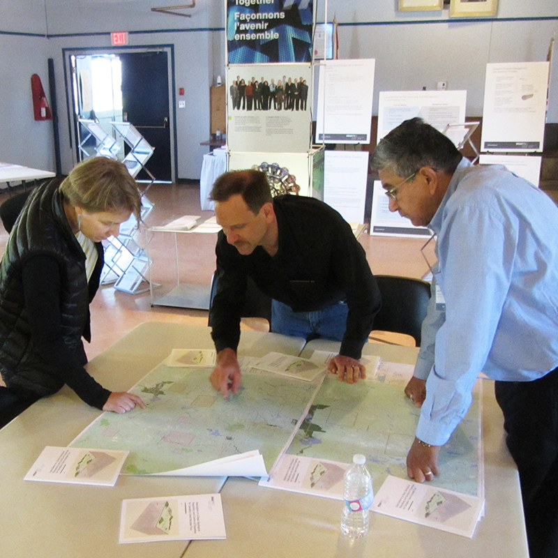 NWMO staff talking with local resident Jon Peroff (middle) during the open house.