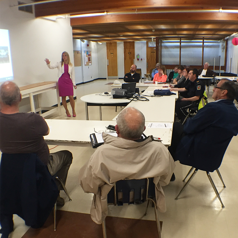 Manitouwadge Nuclear Waste Community Liaison Committee members sit and listen to a presentation given by Michelle Dassinger of the NWMO exploring the new website.