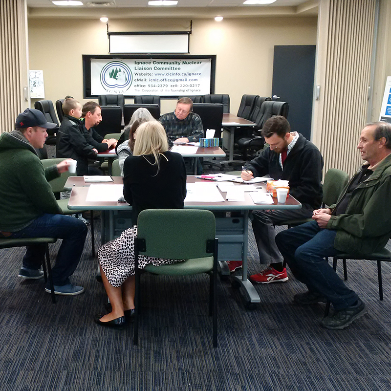 The image shows Ignace and area residents sitting around a table in the Learn More Centre.