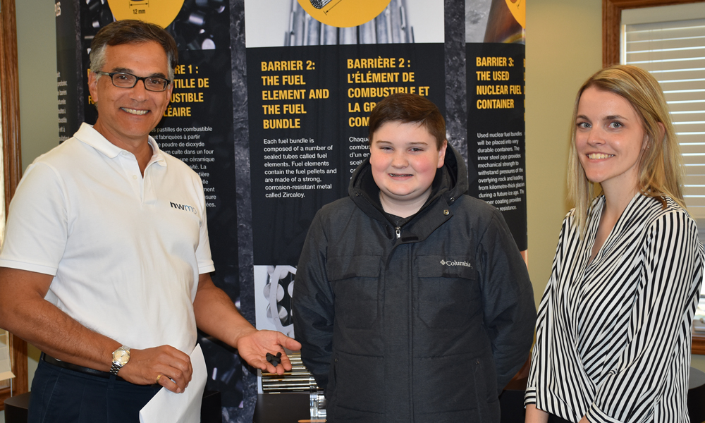 This photo shows a picture of Andre Vorauer, Senior Technical Specialist for the NWMO, South Bruce resident Rhys Tiffin, and Janelle Blackwell, Project Coordinator for the Municipality of South Bruce at the April Open House.