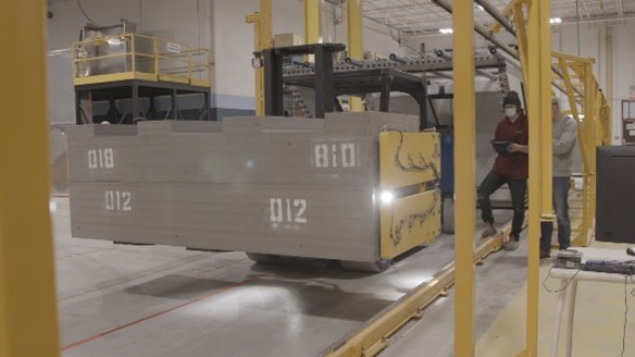 A forklift lifting buffer boxes