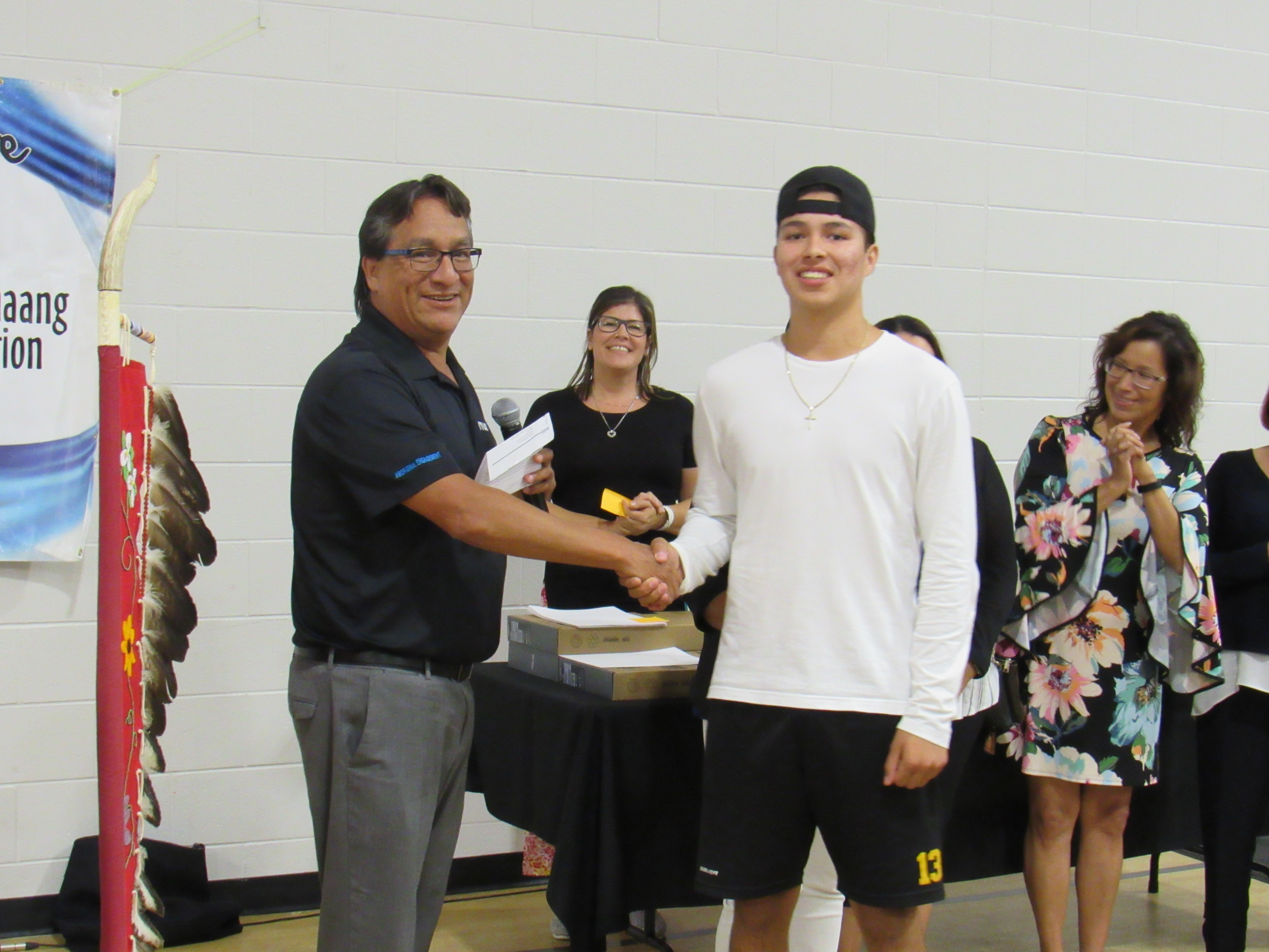 Greg Plain, Senior Engagement Advisor for southern Ontario at the NWMO, awards a scholarship to Great Lakes Secondary School student Levi Plain.
