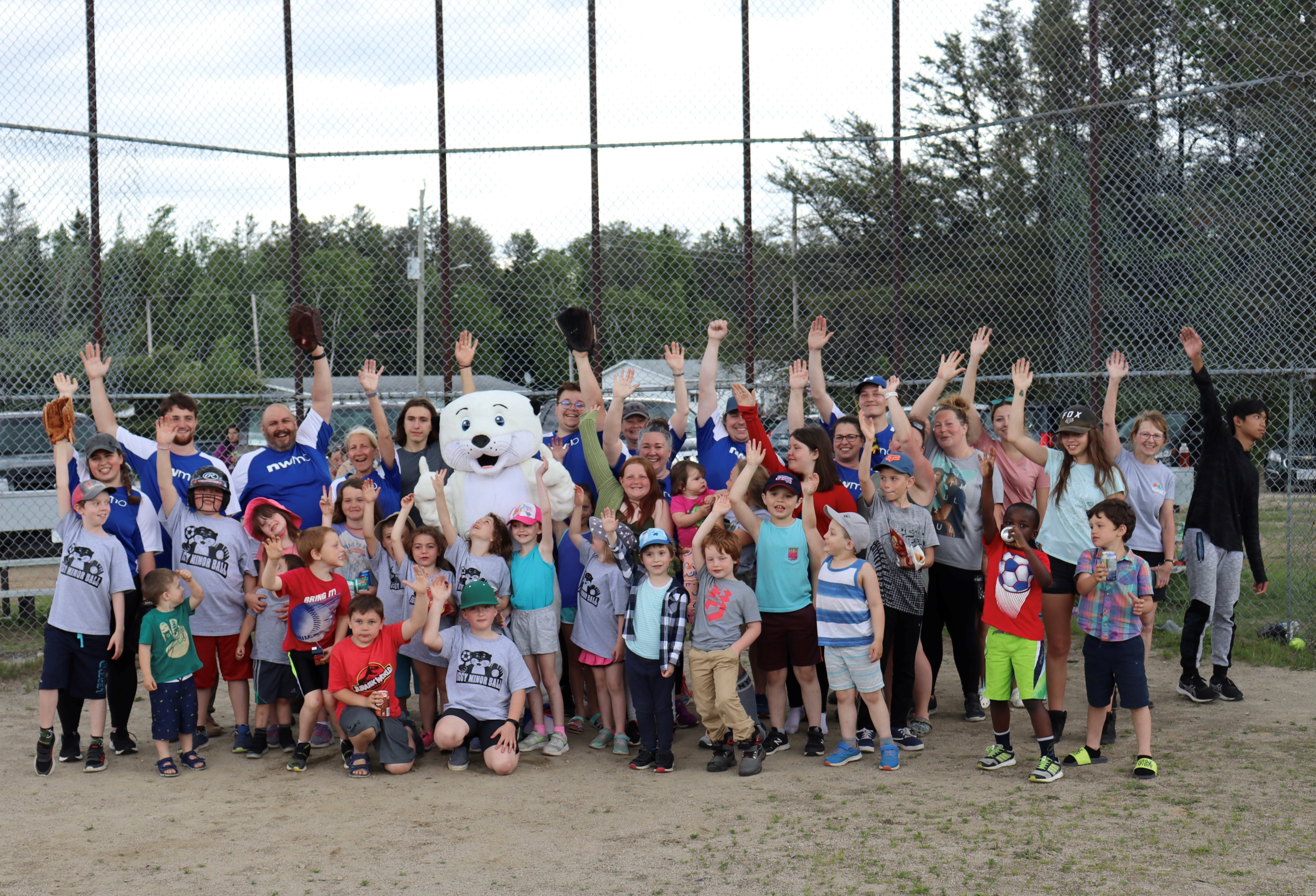 Group photo at a baseball field.