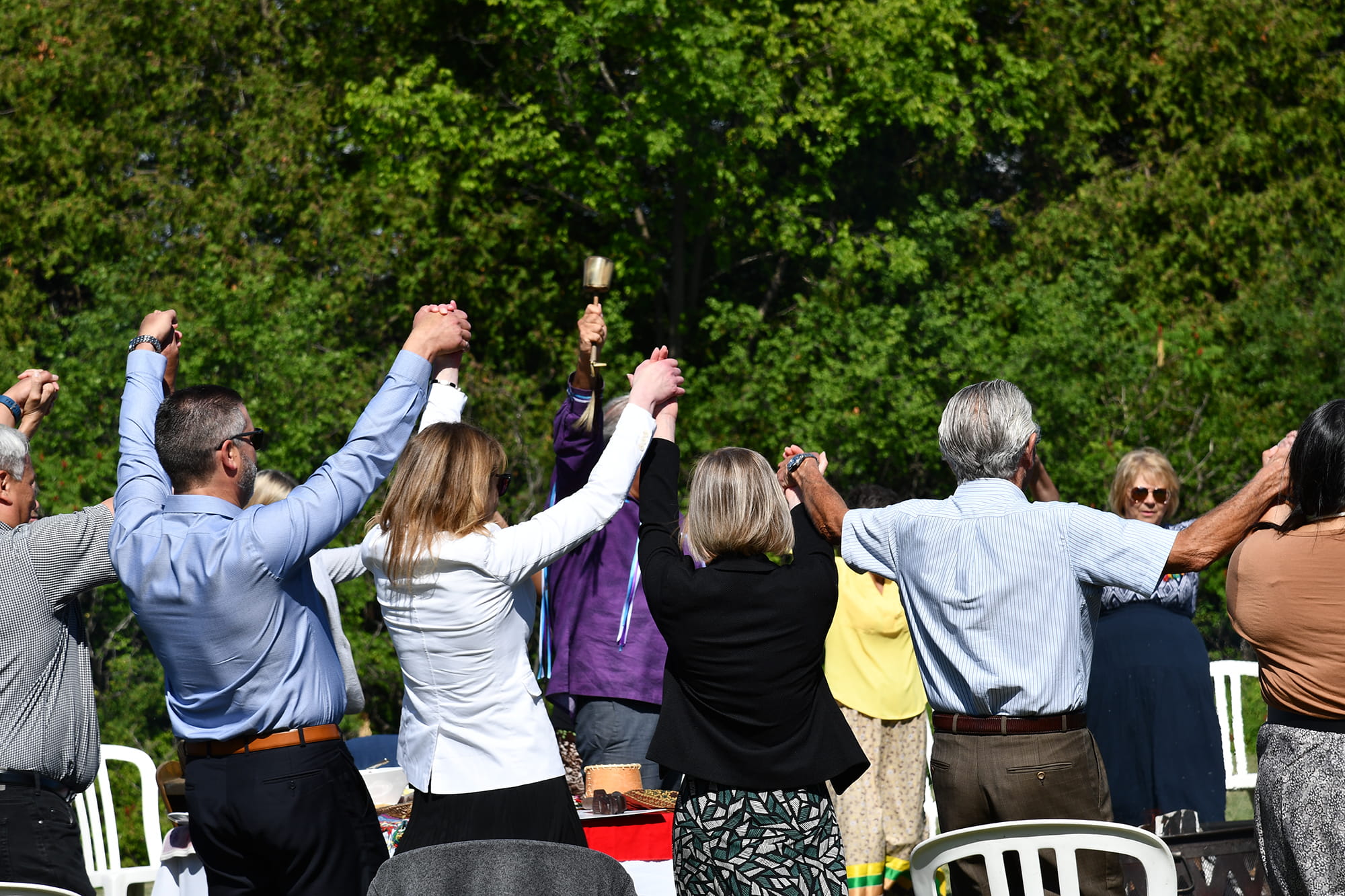 Group of people holding hands