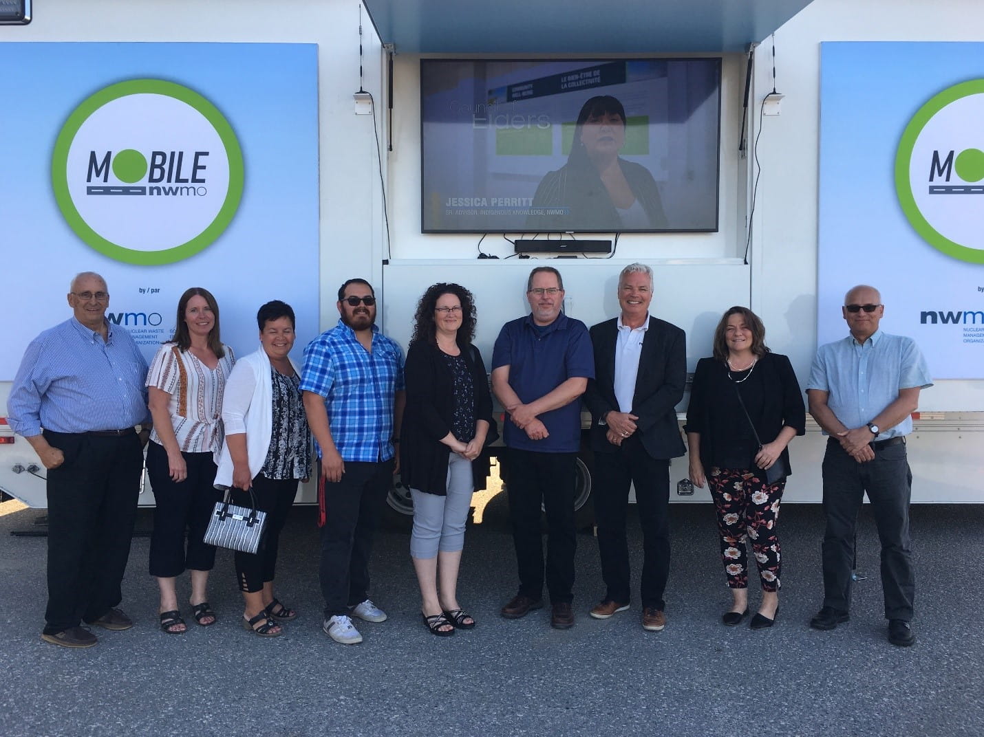 Mobile Learn More Centre in Hearst – from Left to right: Maurice Tanguay, Chairperson Nord-Aski Board; Carol Barnes, NWMO Community Liaison Manager; Josée Vachon, Nord-Aski Business and Financial Analyst; Gaëtan Baillargeon, 2nd Vice-Chairperson Nord-Aski Board; Lena Callewaert, Nord-Aski Office Administrator; Gilles Matko, Nord-Aski Executive Director; Norman Sandberg, NWMO Relationship Manager; Hélène Coté, Treasurer Nord-Aski Board; and Tim Weber, NWMO Social Research Associate.