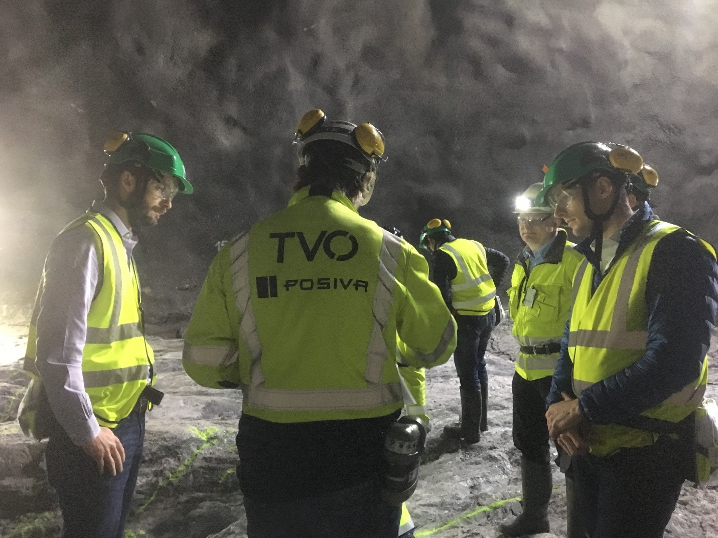 Chris Boyle (left), NWMO Director of Engineering, and Mark Gobien (right), Safety Assessment Models Section Manager, tour the Posiva project in Finland, along with Arto Laikari, a senior scientist involved with the project.