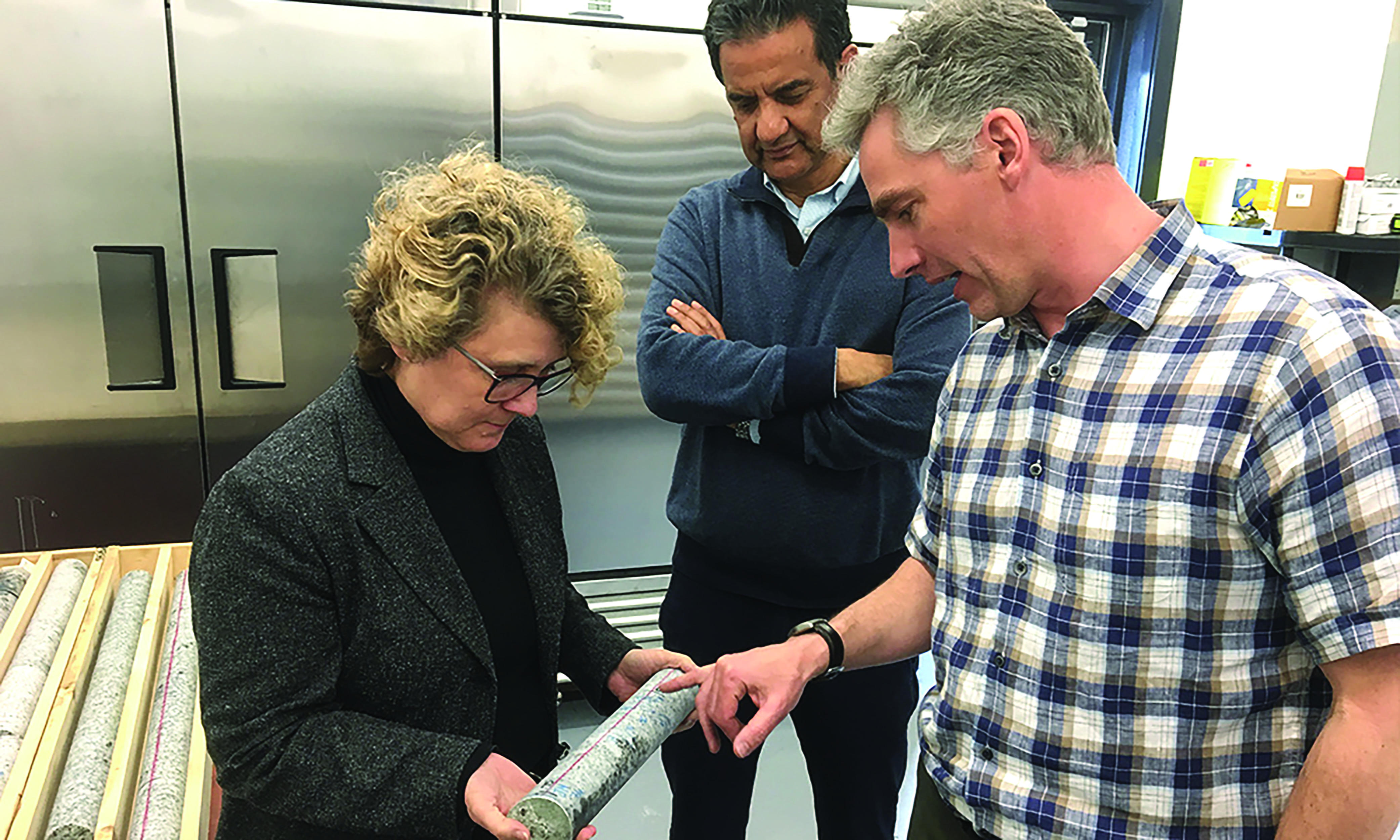 NWMO staff reviewing borehole sample. 