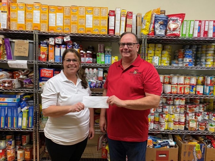 The NWMO presents a cheque to the Dryden Food Bank