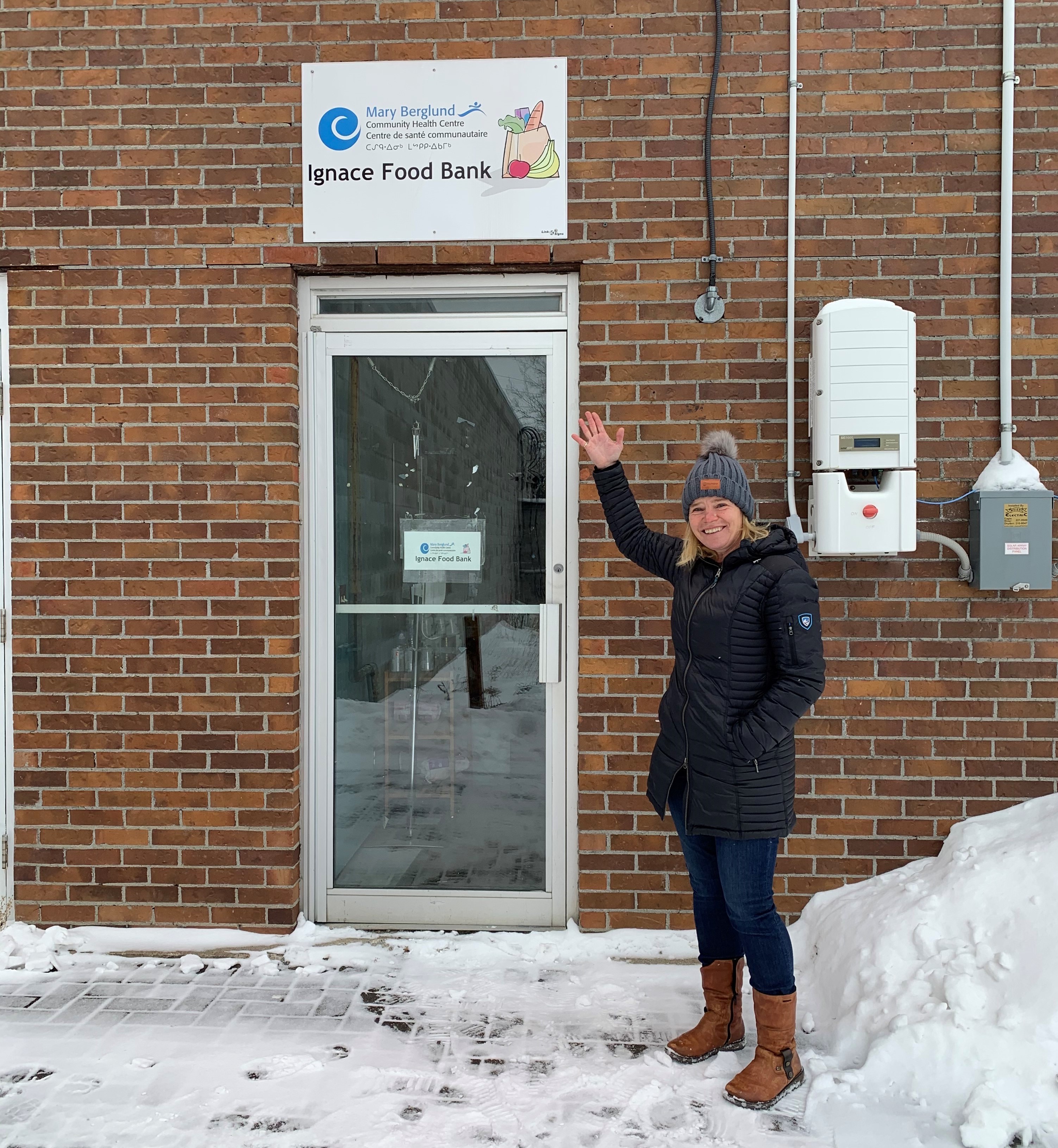 Woman in front of food bank