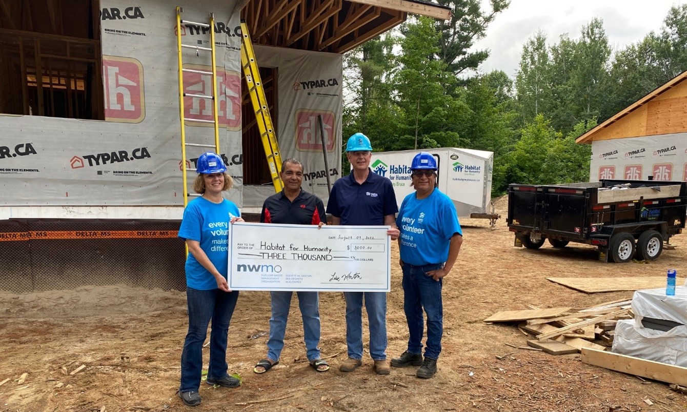 The NWMO presents a cheque supporting the Habitat for Humanity build at Saugeen First Nation (Left to Right: Lise Morton, Vice President of Site Selection at the NWMO, Chief Lester Anoquot of Saugeen First Nation, Greg Fryer, Habitat for Humanity Executive Director and Greg Plain, Southern Ontario Senior Engagement Advisor.)