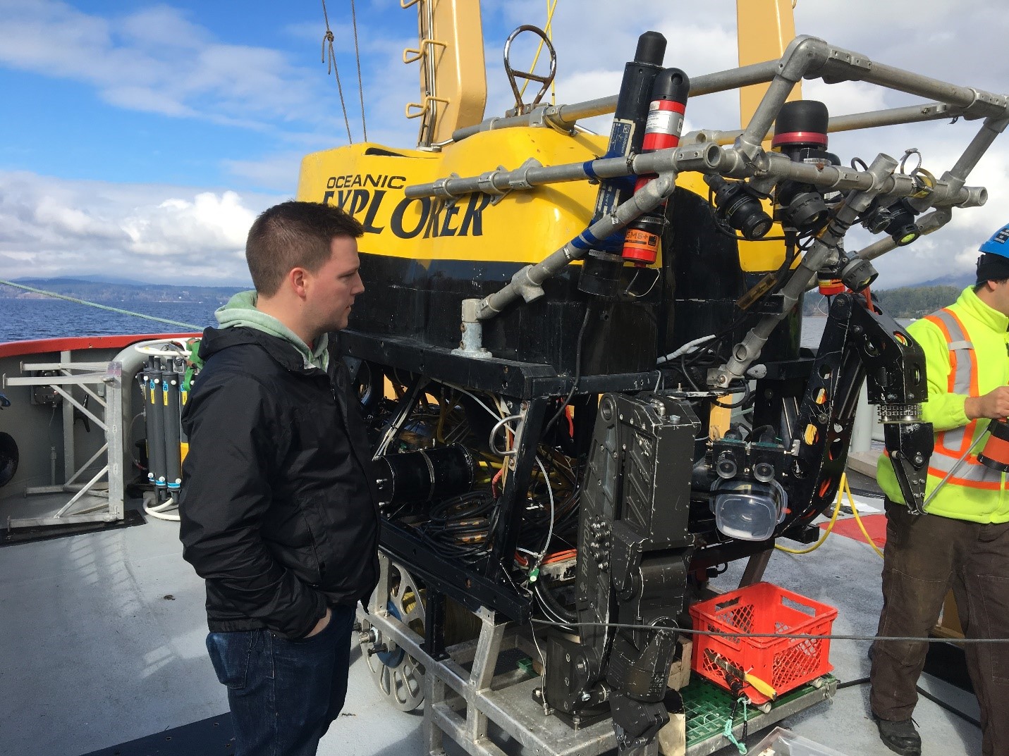 Dr. Jeff Binns, a corrosion scientist with the NWMO, examines a robot used in underwater research by Ocean Networks Canada.