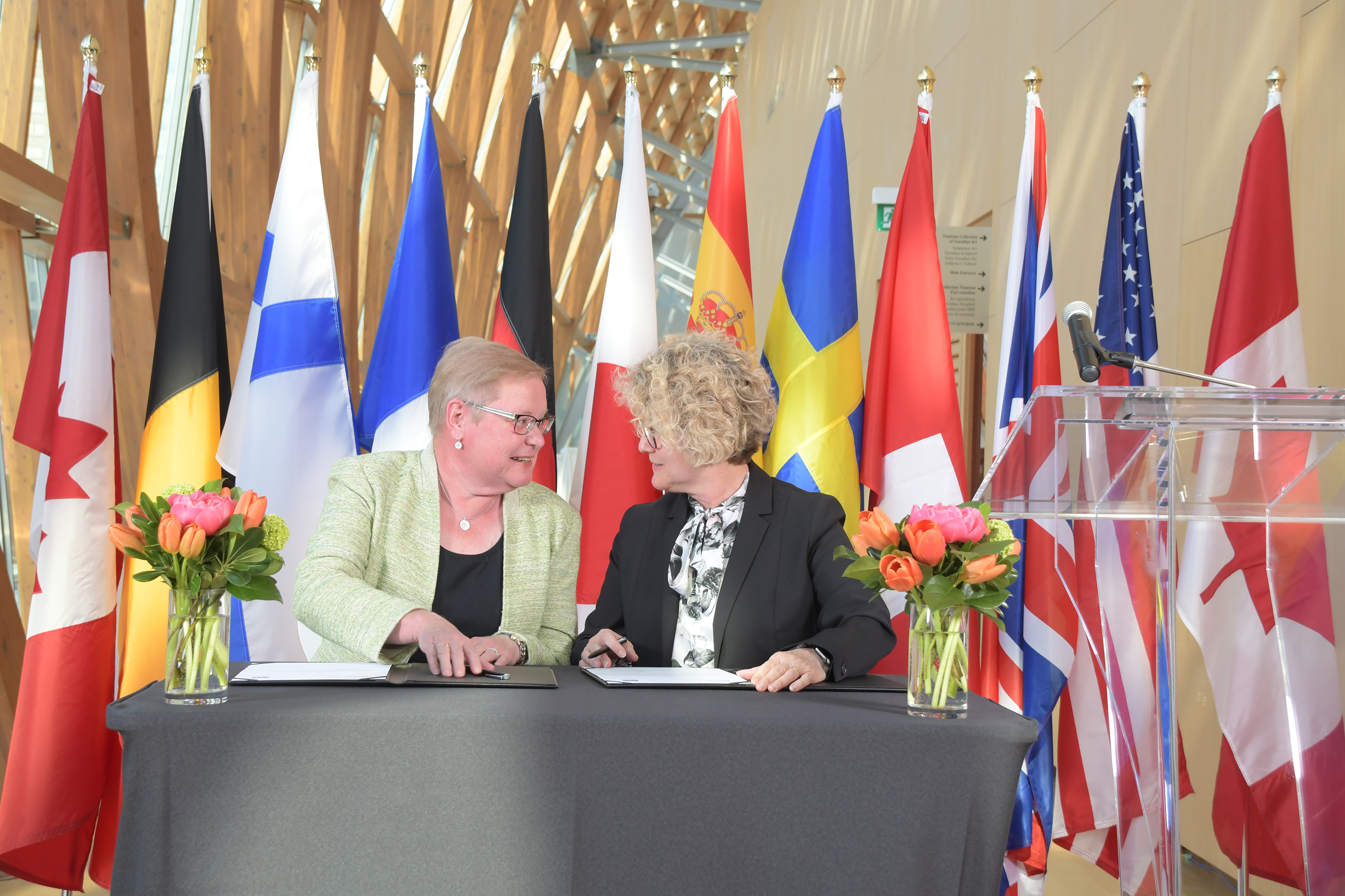 NWMO president and CEO, Laurie Swami (right), signing a co-operation agreement with SKB in Toronto on May 14, 2018
